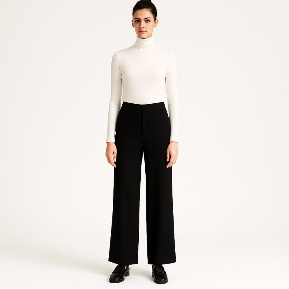 Katherine Kelly black wide leg trousers with wide band that sits below waist.